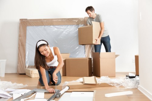 Packed boxes and furniture ready for urgent removals in Maida Vale
