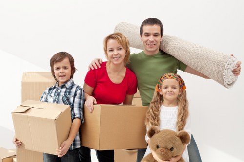 Careful transport of boxes and furniture in a residential London street