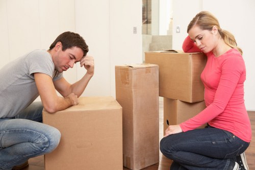 Movers handling desks and office items in a Maida Vale commercial property
